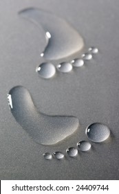 Bare Human Footprints Made From Drops Of Water