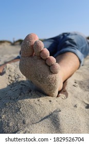 
Bare Mens Toes In The Sand