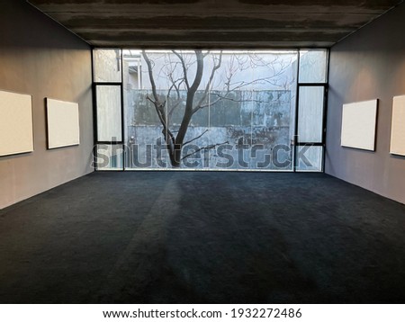 Bare tree seen trough open window at winter
