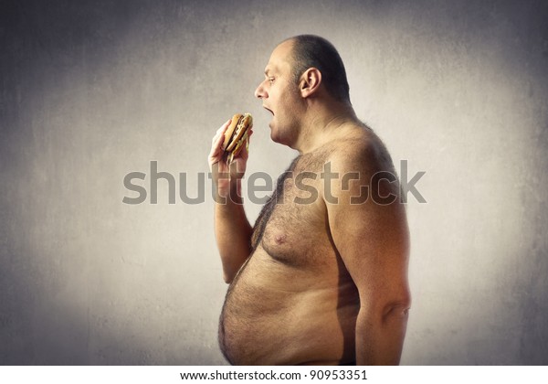Barechested Fat Man Eating Hamburger Stock Photo Edit Now