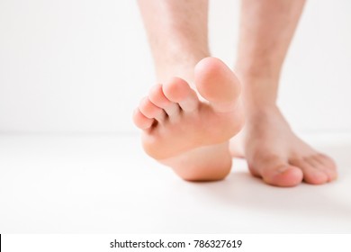 Barefoot. Cares About A Man's Clean And Soft Foot Skin. Body Care Concept.