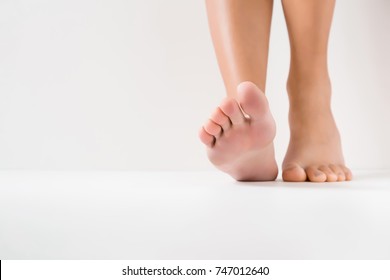 Barefoot. Cares about a woman's clean and soft foot skin. Body care concept.