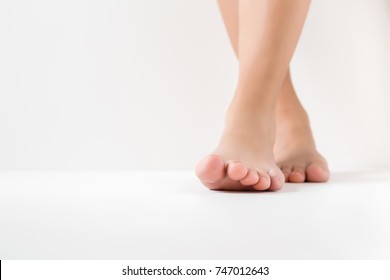 Barefoot. Cares About A Woman's Clean And Soft Foot Skin. Body Care Concept.