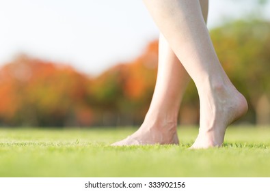 Barefoot Feet Walking On Grass