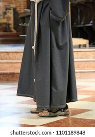 Barefoot Franciscan Friar With Sandals In The Church