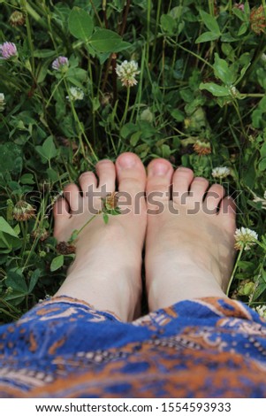 Feet of a woman wearing sandals