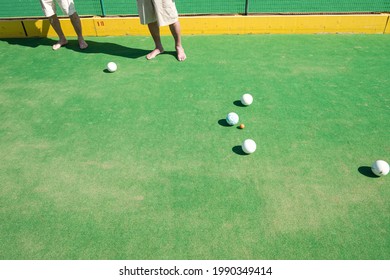 Barefoot People Playing Lawn Bowls Together, Leisure And Summer Concept