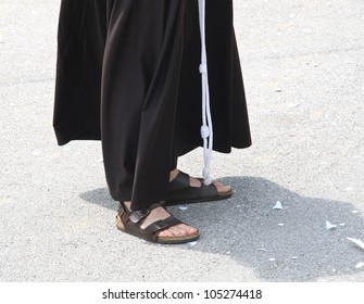 Barefoot With Sandals And The Habit Of A Franciscan Friar