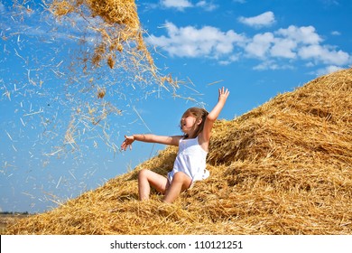 Barefoot Summer Kid Throwing Hay