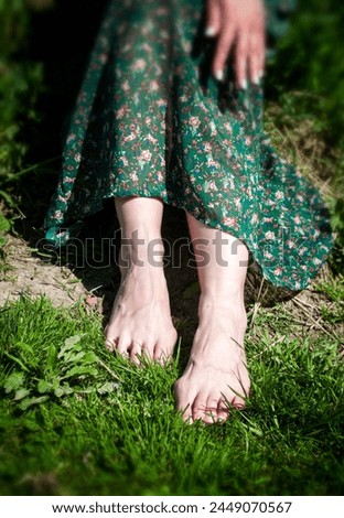 Similar – Feet of a woman wearing sandals