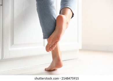 Barefoot Woman Near Counter In Kitchen, Closeup