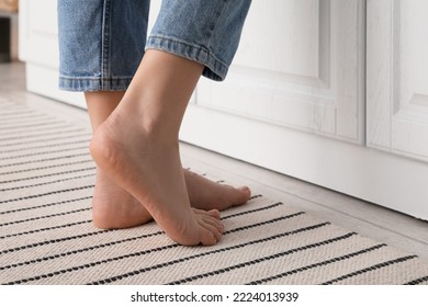Barefoot woman on carpet at home, closeup - Shutterstock ID 2224013939