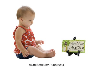 Barefooted Little Girl Sitting By A Please Remove Your Shoes Sign