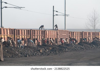 Bareilly, Uttar Pradesh, India- March 12 2013: Worker Unloading Coal Train Near Bareilly Is A Metropolitan City In Bareilly District