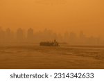 Barge Boat on the East River in New York City with Massive Air Pollution from Wildfires