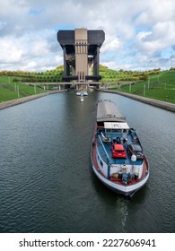 barge enters ship elevator of strepy-thieu in canal between brussels and charleroi in belgium