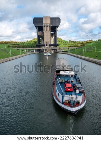 barge enters ship elevator of strepy-thieu in canal between brussels and charleroi in belgium