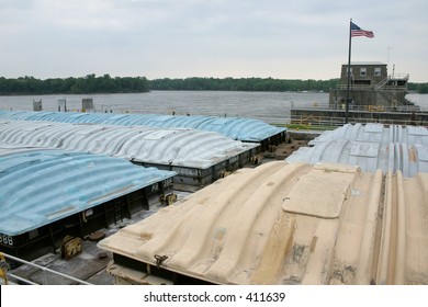 A Barge On The Upper Mississippi River Locks Through On It's Way Downstream.