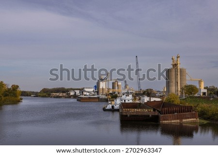 Barges at a grain loading facility along the Mississippi River.