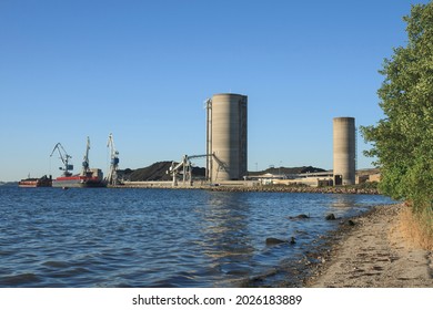 Barges At A Power Plant Near Aarhus, Denmark, Before Changing From Coal To Biomass