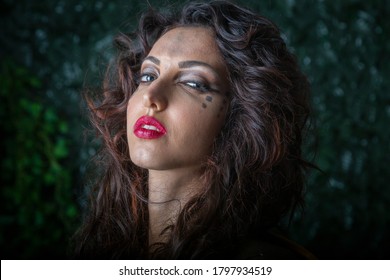 Bari, Puglia/ Italy - July 17 2016: Outdoor Night Ray Of The Moon Illuminates The Face Of A Young And Beautiful Italian Woman Model In The Medieval Fantasy Scene As An Amazon