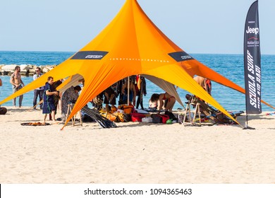 Bari/Italy - 04 21 2018: Group Of Person Under A Beach Tent During The Event Of A Wind Surf School In The City Of Bari, In The South Of Italy.