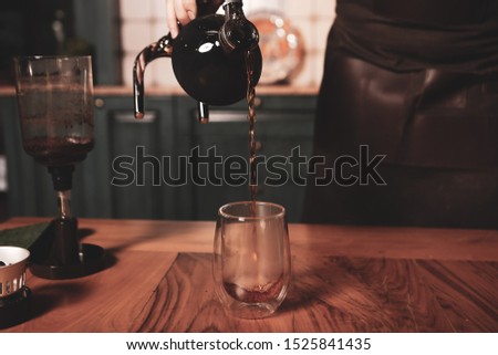 barista brewing coffee in the coffee room