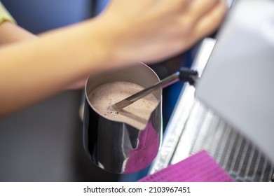 Barista Making Coffee And Stirring Milk