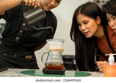 Barista Is Making A Cup Of Cappuccino In Coffee Shop Bar,Professional Barista Preparing Coffee Using Chemex Pour Over Coffee Maker And Drip Kettle,Alternative Ways Of Brewing Coffee.