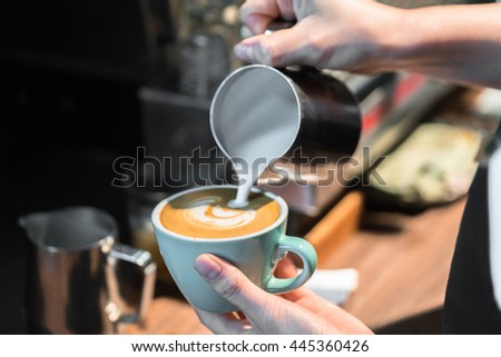Barista making fresh coffee latte
