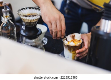 Barista Making Iced Latte Coffee By Pouring Espresso Shot.
