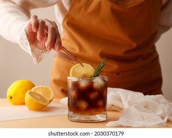 Barista making a lemon juice iced coffee