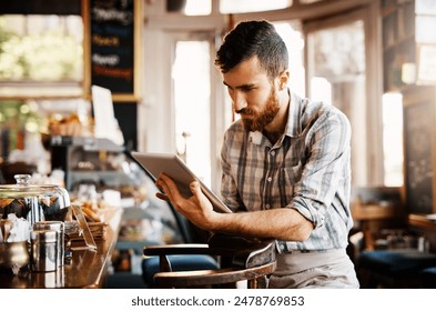 Barista, man and tablet for coffee shop inventory or online order on website in startup cafe. Small business owner, waiter and review with technology for stock menu or price checklist in store