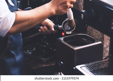 Barista Men Cleaning Coffee Maker