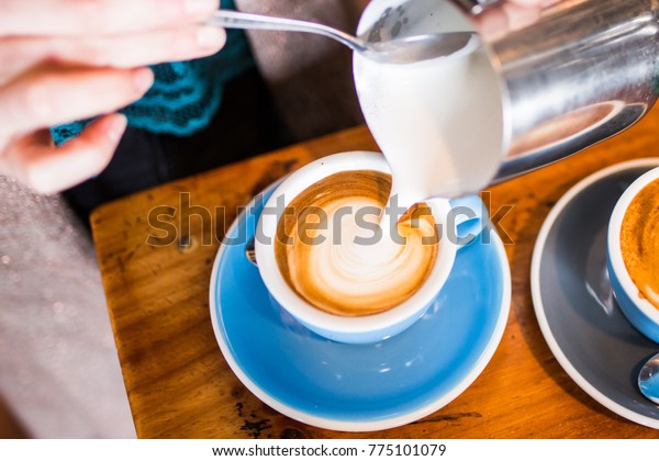 Barista Pouring Flat White\
Coffee