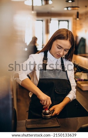 Barista preparing coffee at a coffee house
