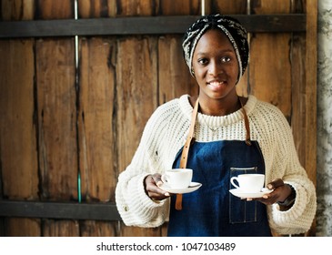 A Barista Serving Coffee