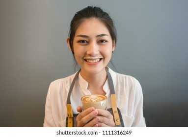 Barista Smiling Young Asian Woman Drink Coffee Making A Mess  Milk Foam On Her Mouth