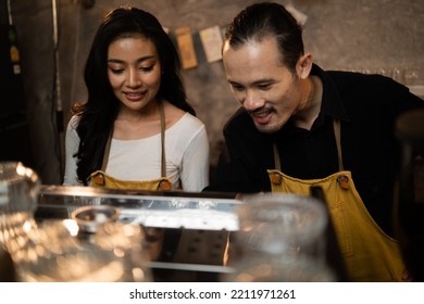 Barista Training Staff Using Coffee Matchine In Coffee Shop Cafe