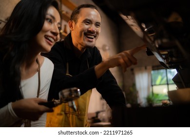 Barista Training Staff Using Coffee Matchine In Coffee Shop Cafe