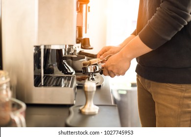 Barista Is Using Brush For Cleaning The Coffee Maker