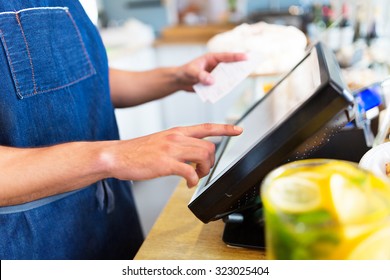 Barista Using Cash Counter
