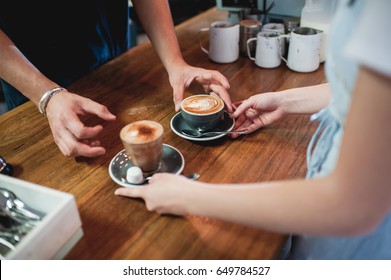 Barista And Waitress Serving Coffee