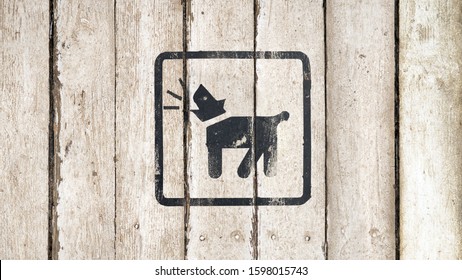 Barking Dog Silhouette In Black Color. Barking Dog Sign On A White Wooden Background. Guard Dog Inside Icon. Dog Barking Icon. Button Image On Wooden Background. Copy Space. Part Of A Series