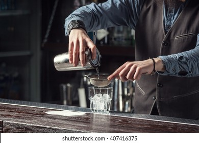 Barman Makes Cocktails With A Shaker.