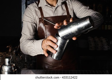 Barman Makes Cocktails With A Shaker.