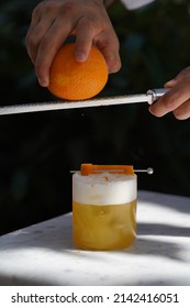 Barman Is Making Cocktail, Close-up. Bartender Making Alcoholic Cocktail At Table, Outdoor