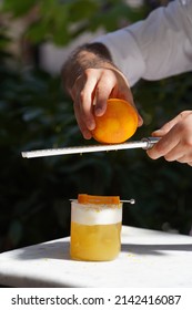 Barman Is Making Cocktail, Close-up. Bartender Making Alcoholic Cocktail At Table, Outdoor