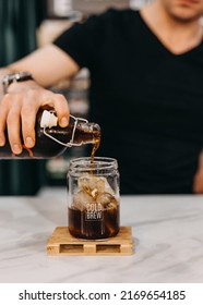 Barman Making A Cold Brew Coffee At A Bar Counter.