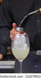 Barman Making A Signature Cocktail